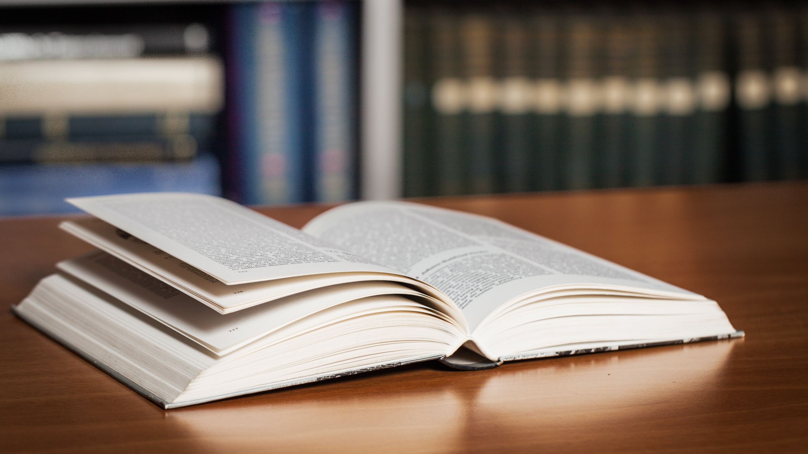 open-book-wooden-table-wisdom-learning-concept