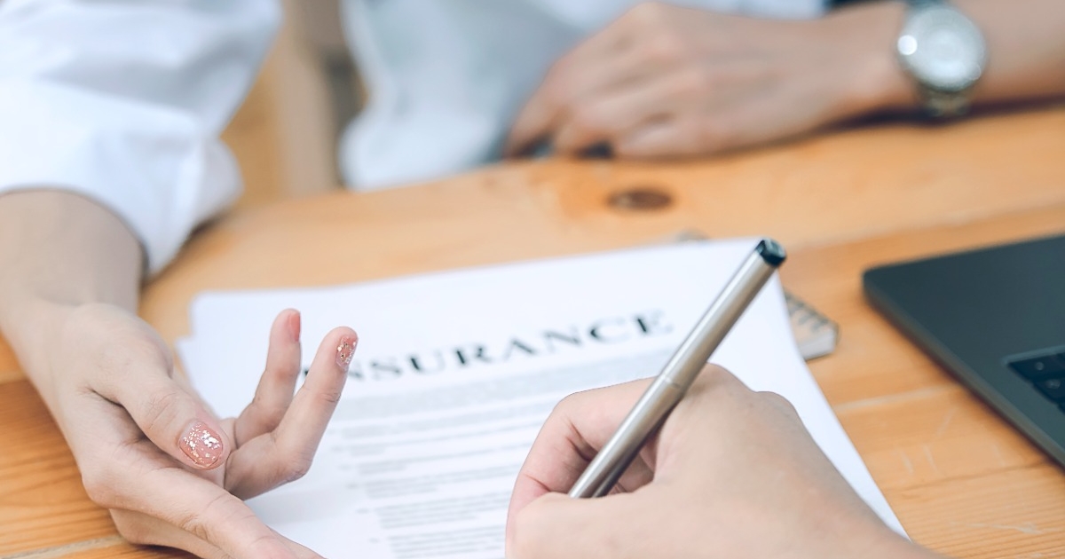 business-partners-signing-contract-woman-showing-where-sign